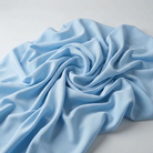 Interlock (Stretch) Wholesale Fabric in Baby/Blue 1120 - loose-fold fabric view