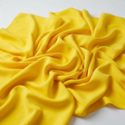 Interlock (Stretch) Wholesale Fabric in Yellow/B 4137 - loose-fold fabric view