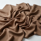 Interlock (Stretch) Wholesale Fabric in Mocha 1772 - loose-fold fabric view