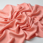 Interlock (Stretch) Wholesale Fabric in Coral/L 8203 - loose-fold fabric view