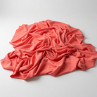 Interlock (Stretch) Wholesale Fabric in Coral/Kiss 1216 - piled fabric view