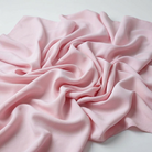Interlock (Stretch) Wholesale Fabric in Pink 1155 - loose-fold fabric view