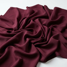 Interlock (Stretch) Wholesale Fabric in Burgundy 1237 - loose-fold fabric view