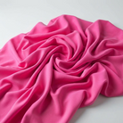 Interlock (Stretch) Wholesale Fabric in Hot Pink 8198 - loose-fold fabric view
