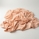 Interlock (Stretch) Wholesale Fabric in Peach 1176 - piled fabric view