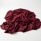 Interlock (Stretch) Wholesale Fabric in Wine 1401 - piled fabric view