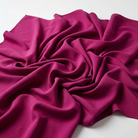 Interlock (Stretch) Wholesale Fabric in Magenta 1825 - loose-fold fabric view