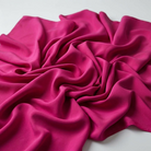 Interlock (Stretch) Wholesale Fabric in Fuchsia 8621 - loose-fold fabric view