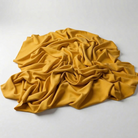 Interlock (Stretch) Wholesale Fabric in Gold 2009 - piled fabric view