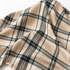 Plaid (Poly Print) in Ivory Noir — loose fabric in a broad flowing drape; fabric-only view, not a finished napkin