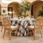 Plaid (Poly Print) in Ivory Noir — table linen in a courtyard table setting